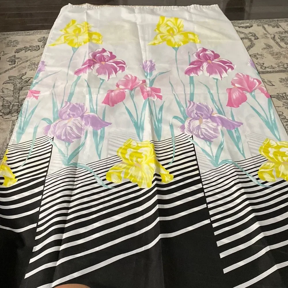 Shower curtain the bottom, black and white as it moves up colors on the flowers